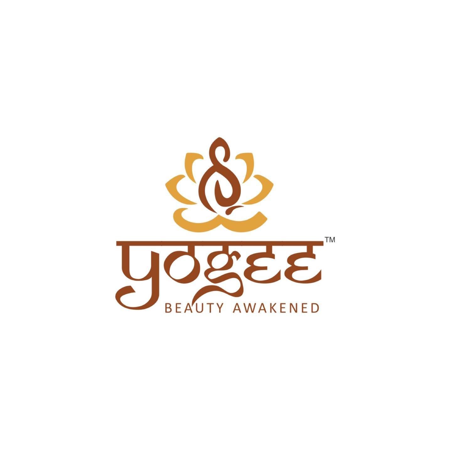 Yogee logo with a brown lotus design and the tagline 'Beauty Awakened'.